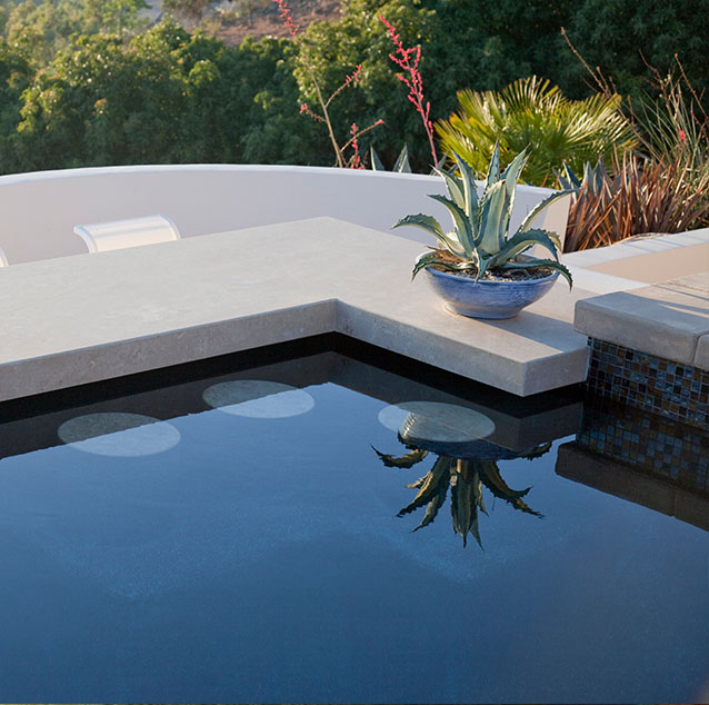 Pour-in-place coping and bar stools in pool
