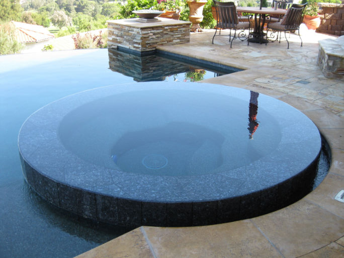 Infinity edge spa inside pool