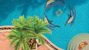 Underwater pool tile art with dolphin and crab mosaics from a pool remodeling project
