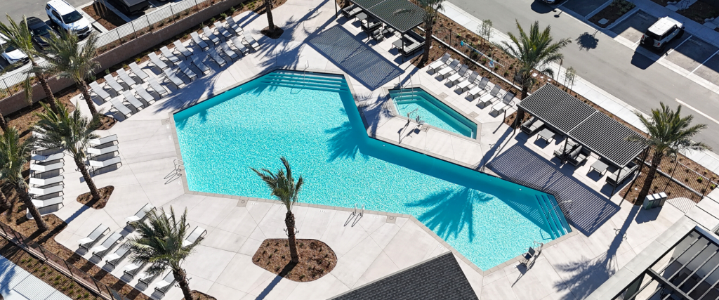 Luxury resort pool remodeling project with attached spa and sunbathing patio deck