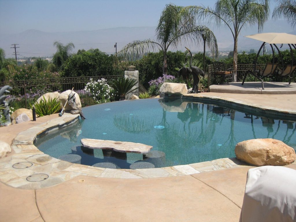 Freeform pool with swim-up bar