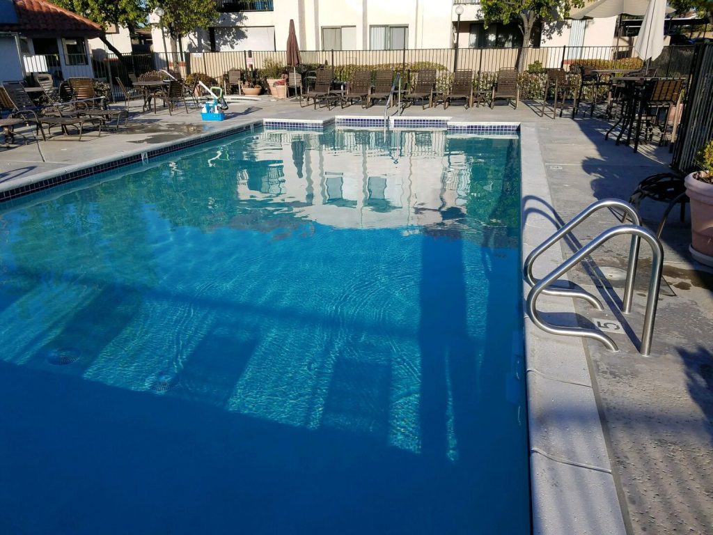 Commercial pool with stainless steel handrail