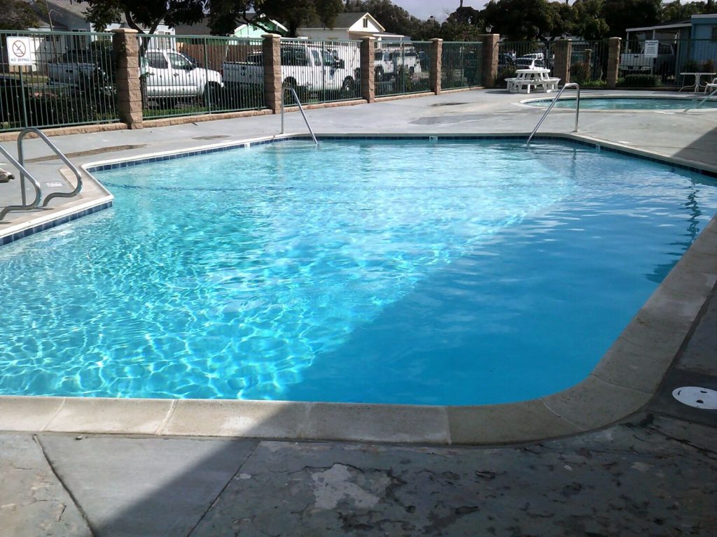 Commercial pool remodeling with safety grip coping tiles