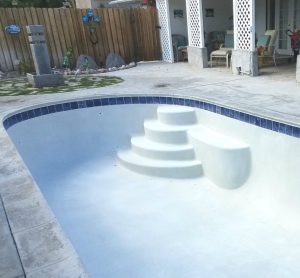 Pool resurfacing with safety grip coping and new plaster finish