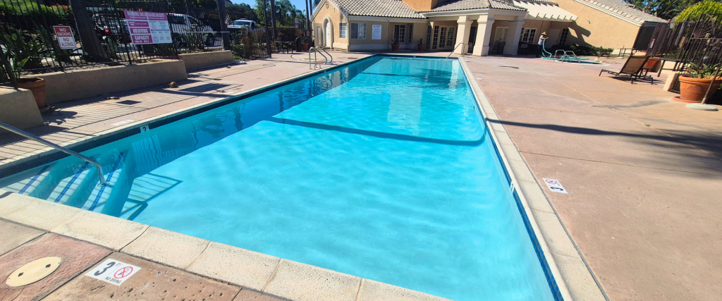 Commercial pool resurfacing project with bright blue plaster finish